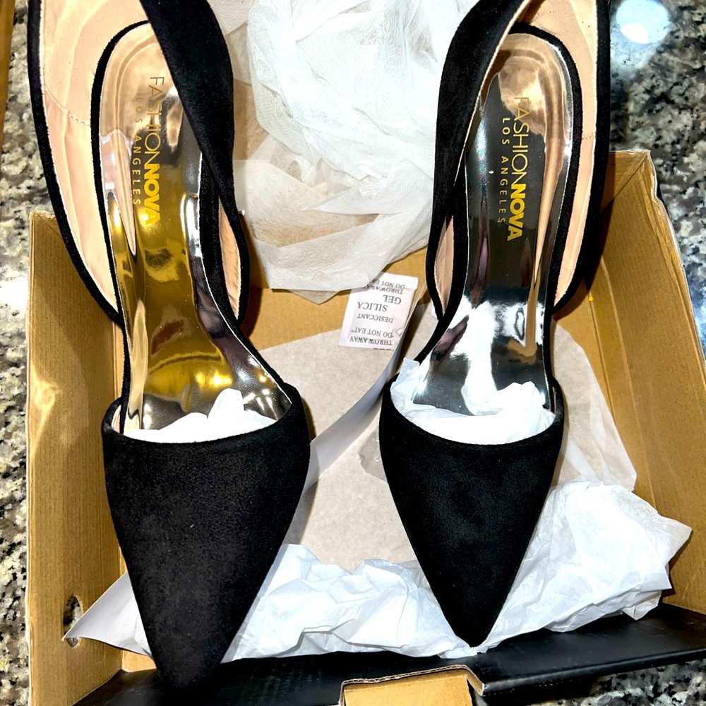 Black suede pumps with silver rhinestone heels.